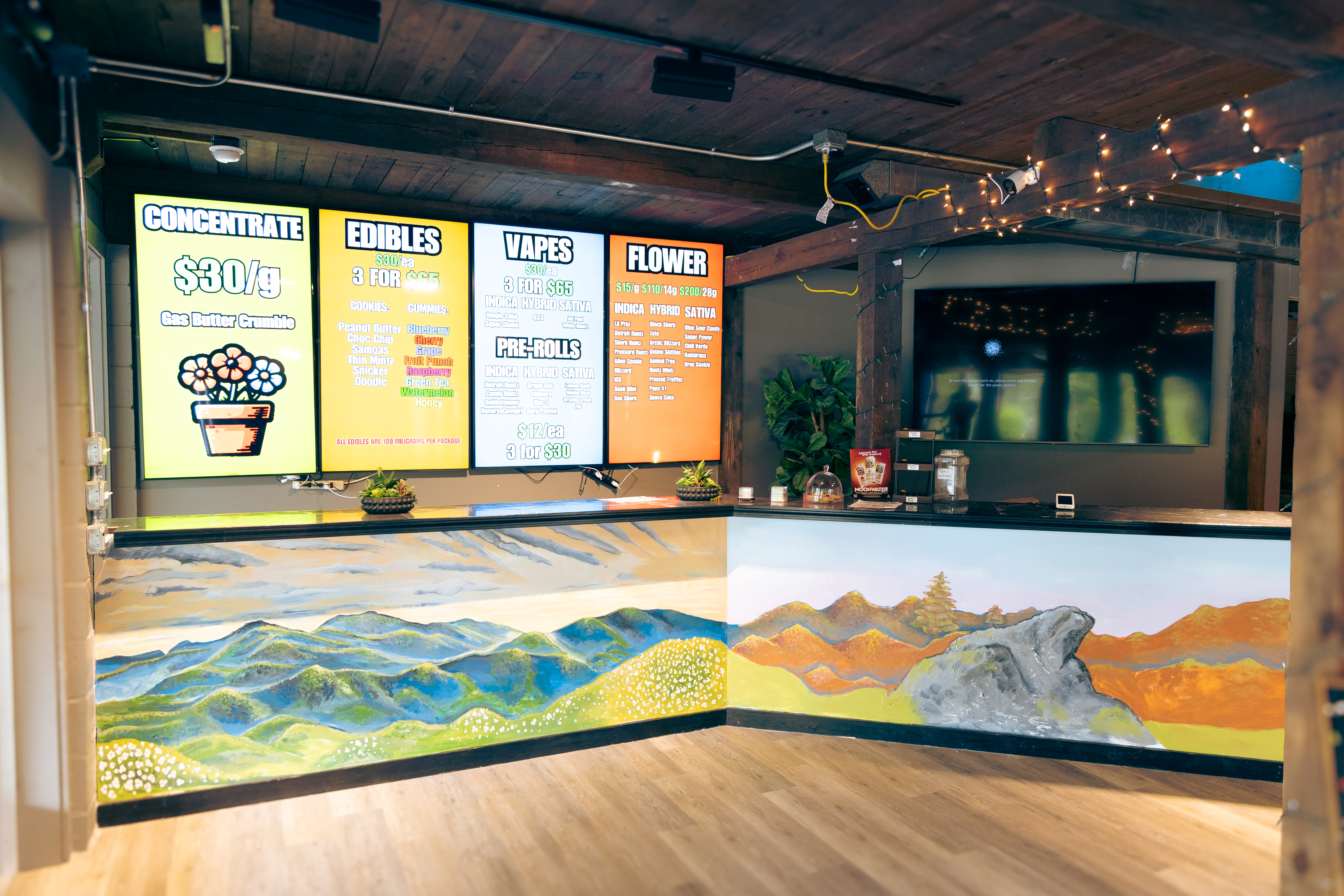 Menu boards with hand-painted mountain mural