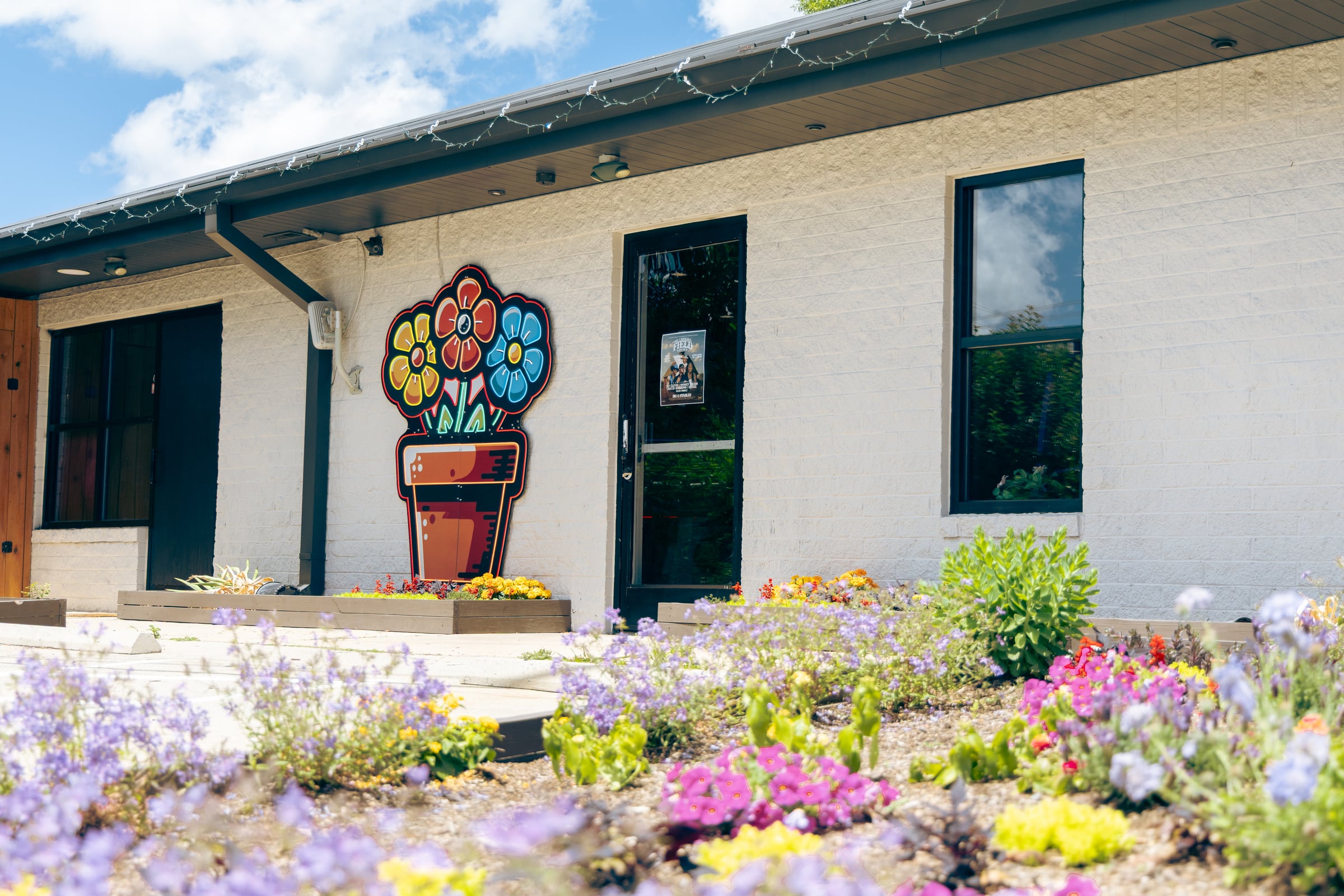 Closeup of mural and colorful garden