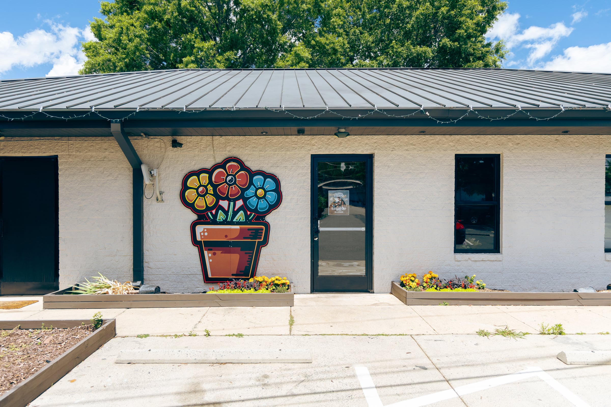 Entrance with mural and planter boxes