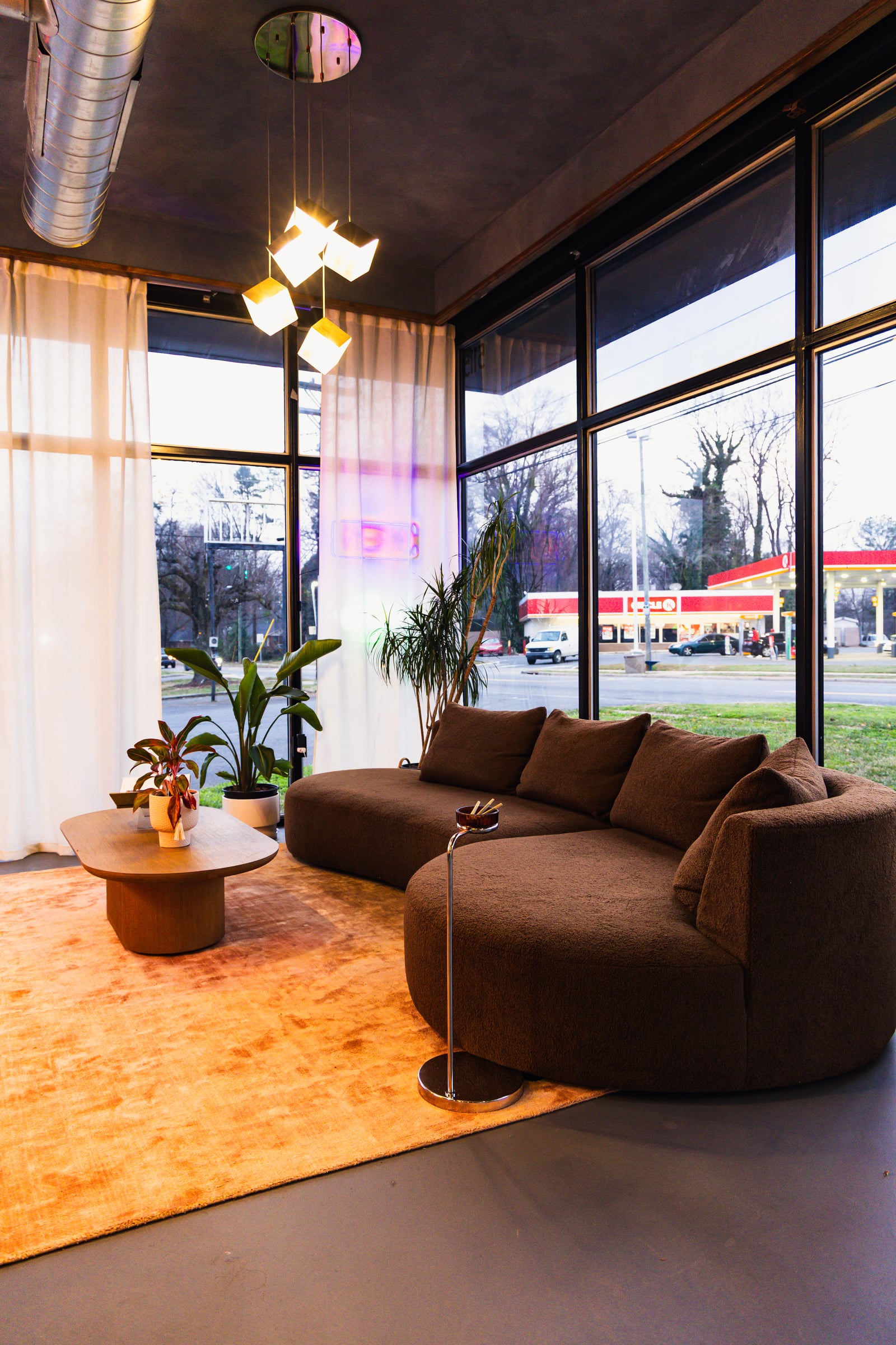 Curved sofa with pendant lights