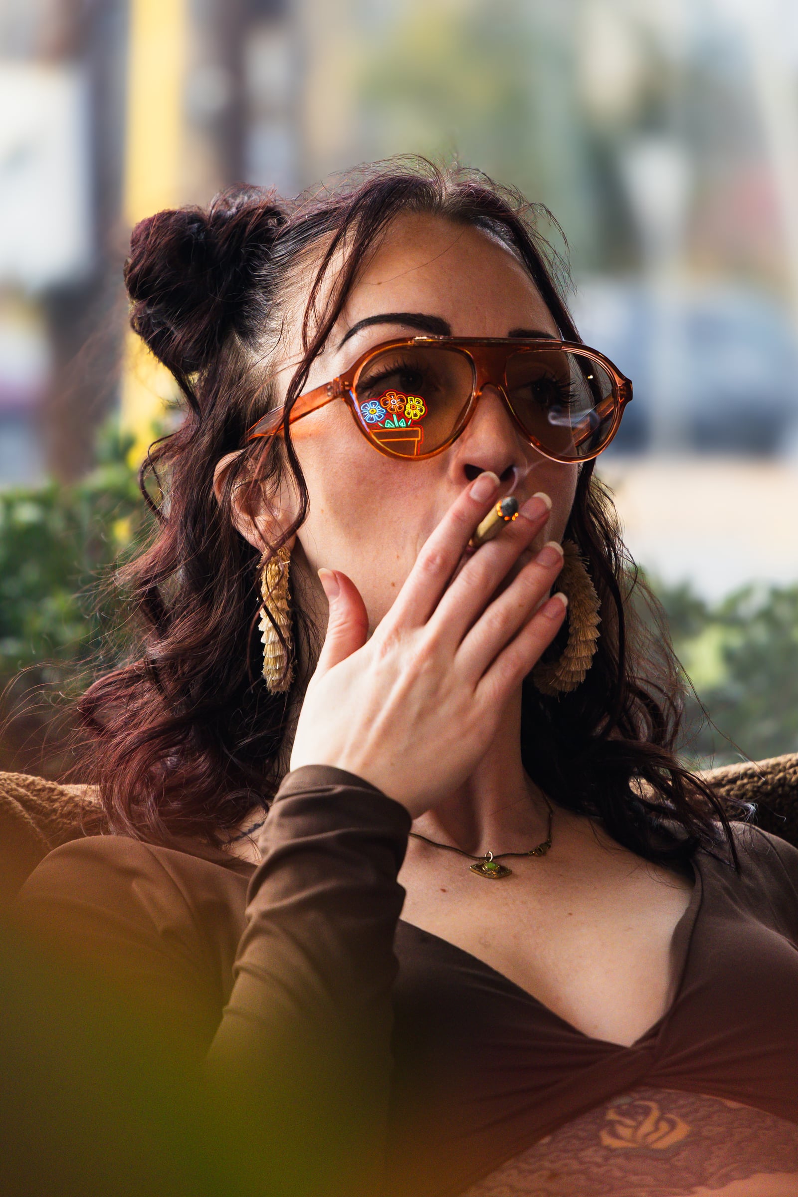 Sunglasses with Flora sign reflected