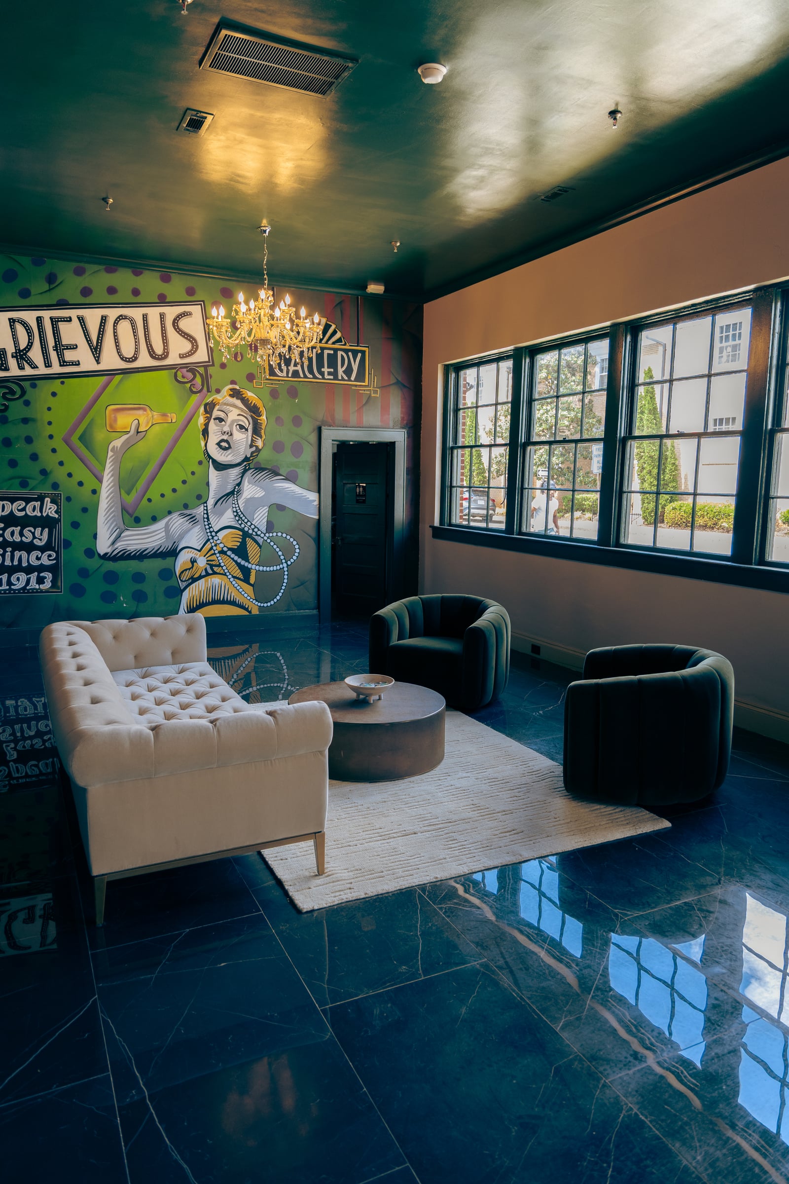 Mural wall with sofa and swivel chairs