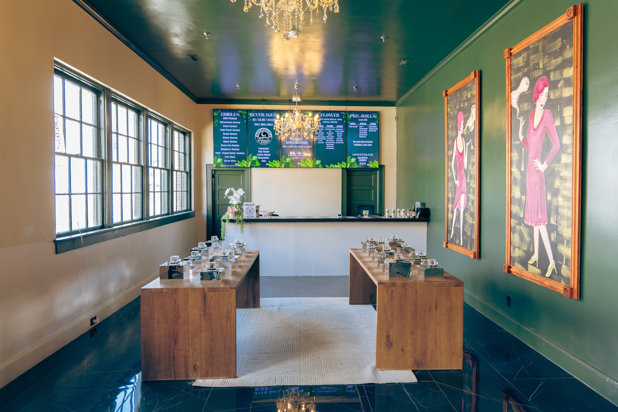 Centered counter with glass jars and green walls